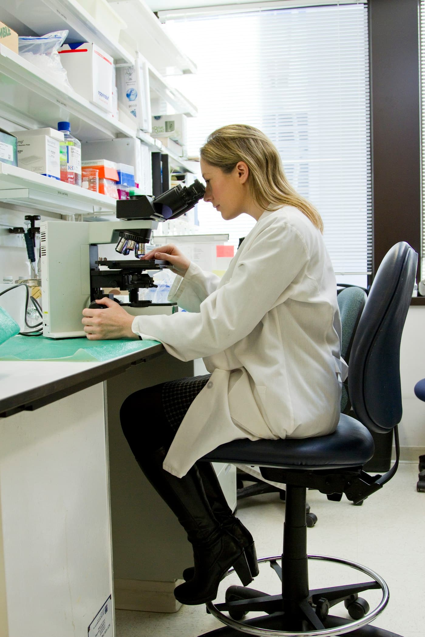 Scientist in protective gear conducting molecular laboratory testing